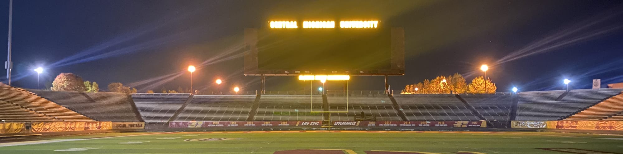 empty football stadium at night under the lights Manhattan